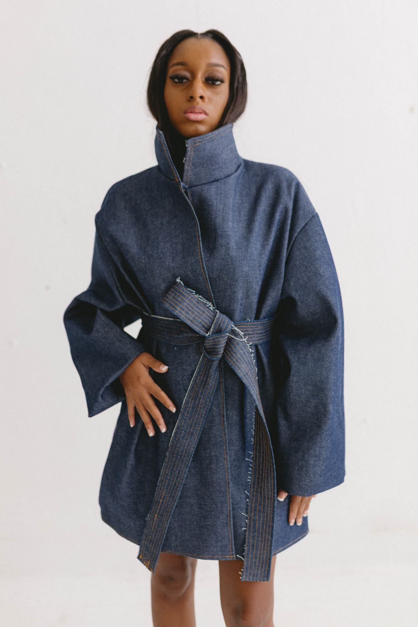 the first impression, belted denim coat with high collar